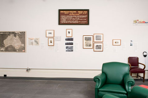 North wall of the gallery with Australian map hung on the far left, alongside other ephemera