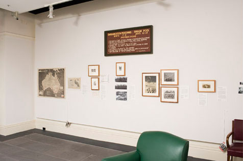 Gallery’s north wall with framed and unframed photos and ephemera