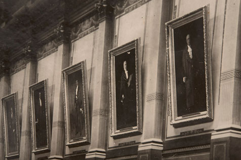 Black and white photo of five formal portraits