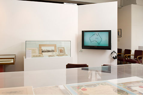 City Gallery’s south wall, with television screen display on right and glass-topped display cases
