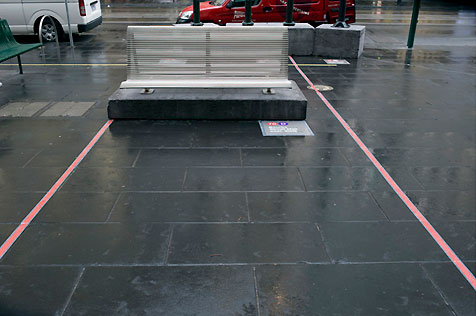 Stainless-steel street seating on pedestal outside the gallery