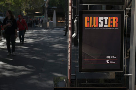 Poster advertising 'Cluster' exhibition outside the Melbourne Town Hall