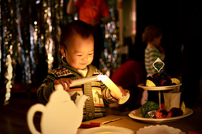 Small child with candle-syhaped lights