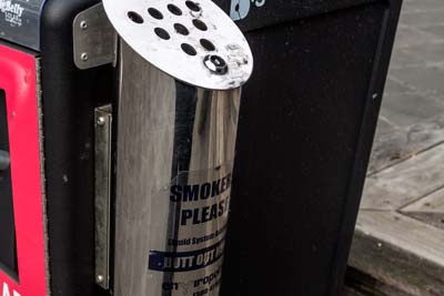 Cigarette butt bin attached to a larger litter bin