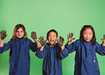 Children holding up muddy hands
