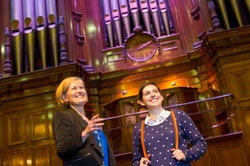Tour guide and visitor in front of the grand organ