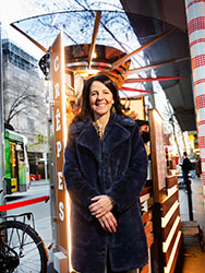 Patrizia Maselli standing in front of the tiny kerbside La Petite Creperie converted from a disused newspaper kiosk.