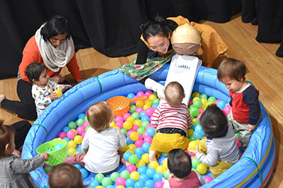 Babies playing in ball pool