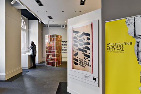 Entrance to the gallery with a large yellow poster advertising the Melbourne Writers Festival and Page Not Found exhibition logo