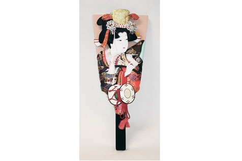 Small wooden racket decorated with a picture of a Japanese woman holding a fan