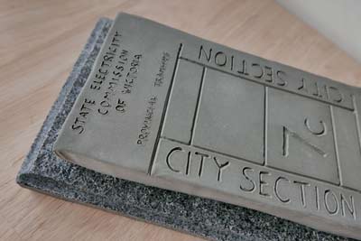A cement plaque inscribed with the words 'State Electricity Commission of Victoria, City Section 7c