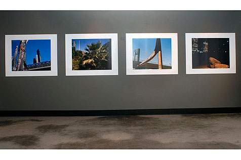 Four photographs arranged horizontally on the wall