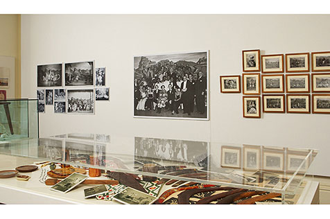 Making a Show of it photos on wall showing aboriginal performers and glass display cases