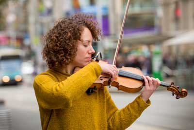 Women playing a violin