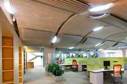 View of office space with undulating ceiling panels