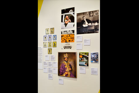 Wall with images and photos including the cover of 'Taxi Talk',