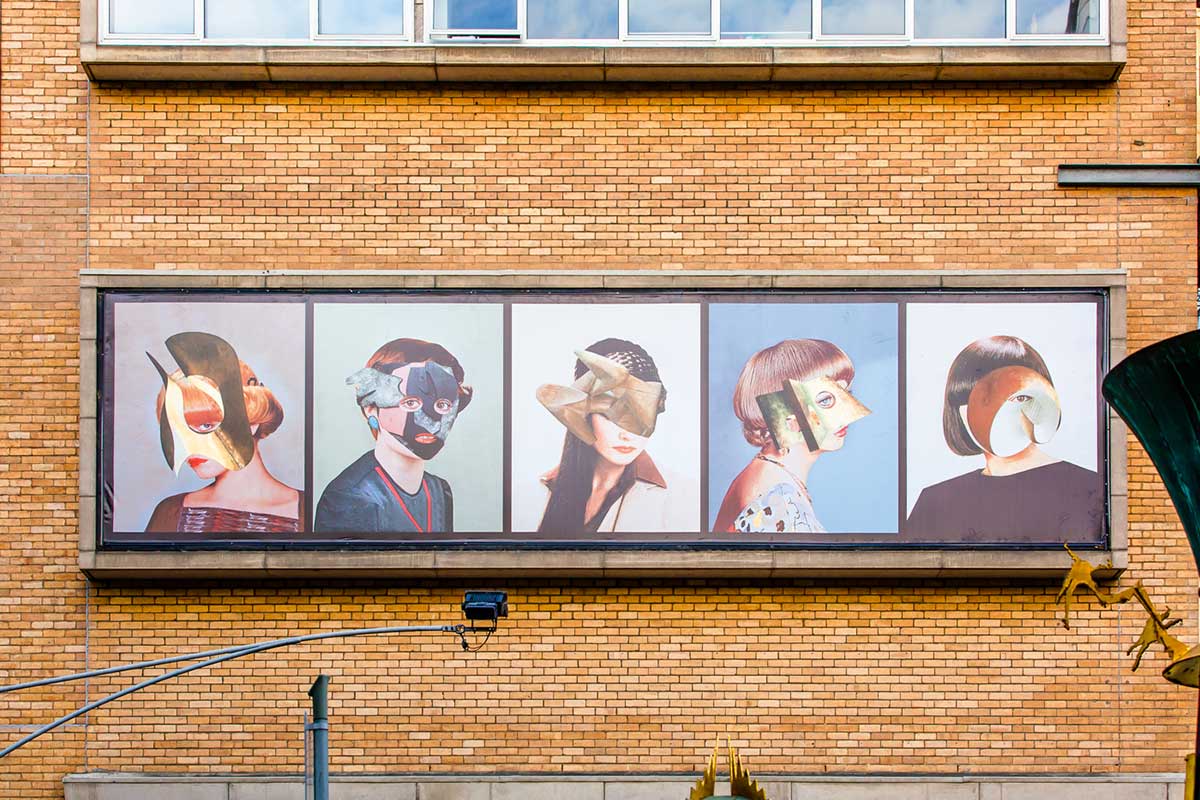 Cropped view of the artwork (directly viewed from the front), showing the complete artwork installed on the building's brick facade.