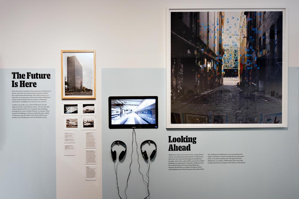 Exhibits titled 'The Future is Here' and 'Looking Ahead' comprising various pictures/photographs and a screen with headphones.