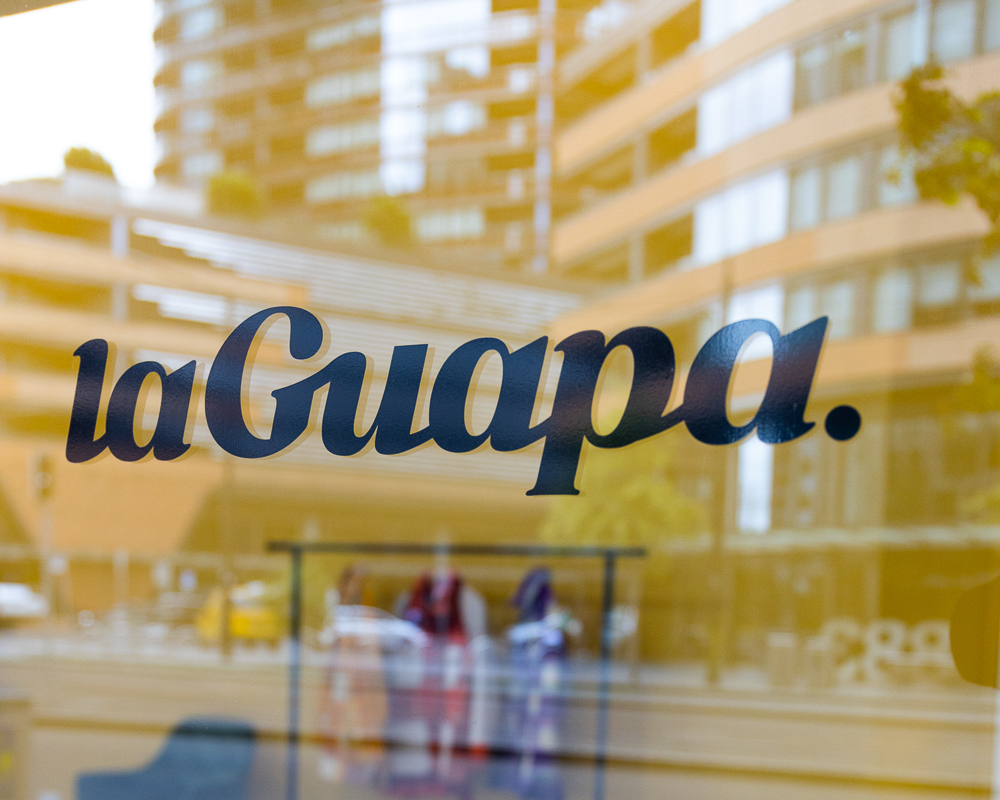 laGuapa shop front window with text reading 