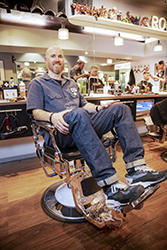 Smiling man in barber's chair