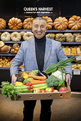 Smiling man with fresh vegetable produce