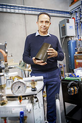 Man standing in composite materials facility