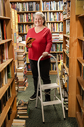 Smiling woman in bookshop