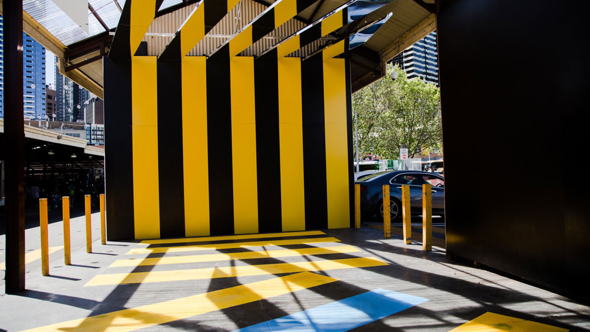 A wall with black and yellow stripes.