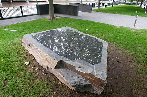 Artwork of slate, granite and glass on grassy area