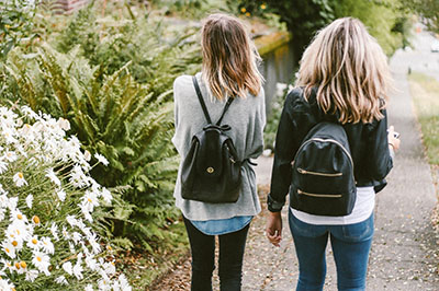 Two young women walking outdoors