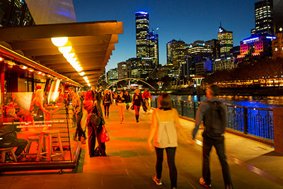 People walking in the Southwharf precinct at dusk