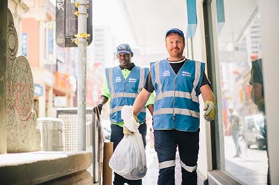 Cleaners picking up rubbish in the city