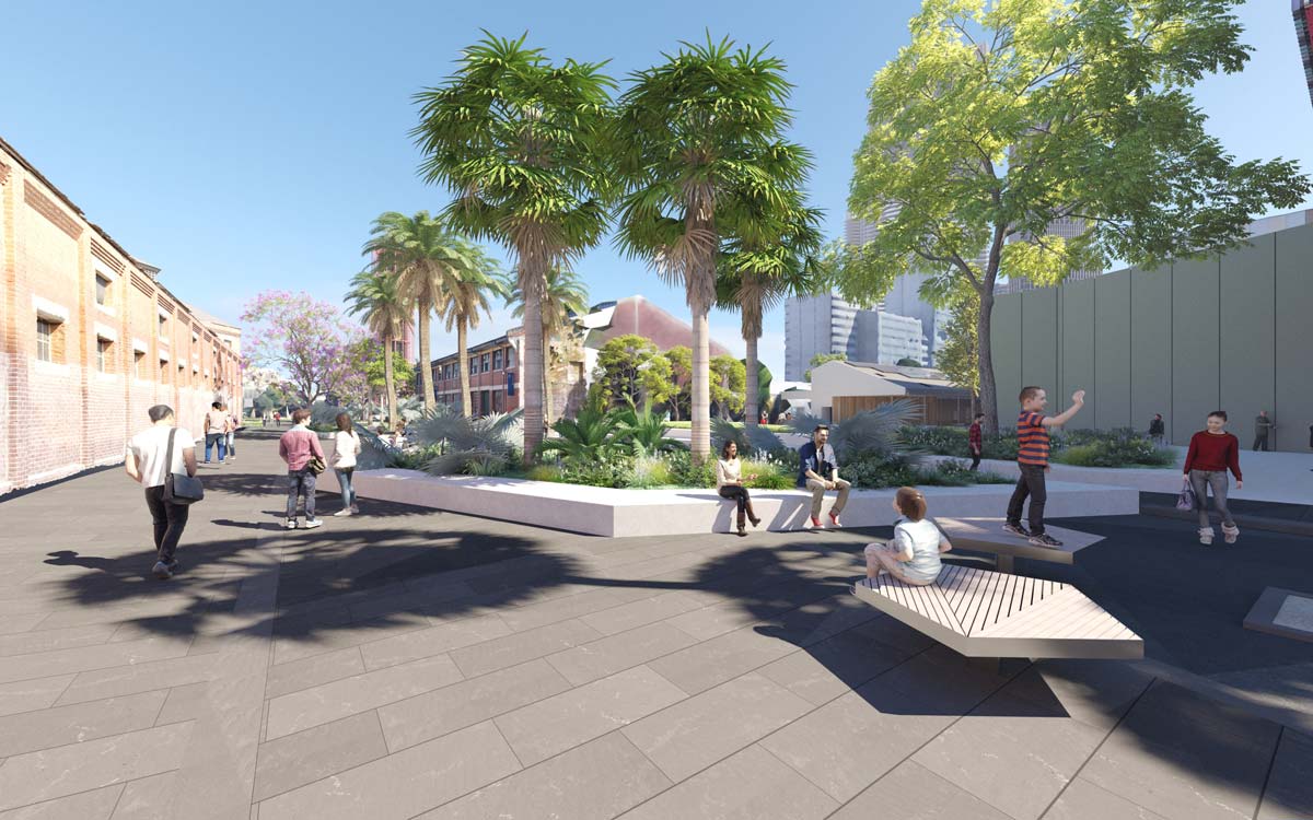 Artist's impression - paved pedestrian area with seating and larged raised garden beds planted with flowers, shrubs and palm trees