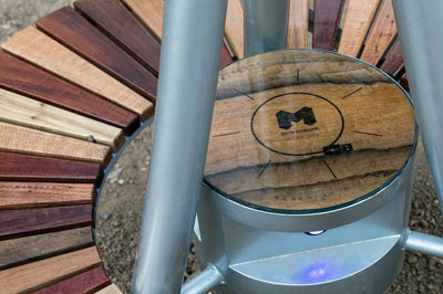 Close up of the wooden seat around the solar tree