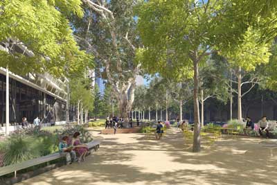 Artist impression showing people in a public open space alongside an office building with trees, tables and chairs, 