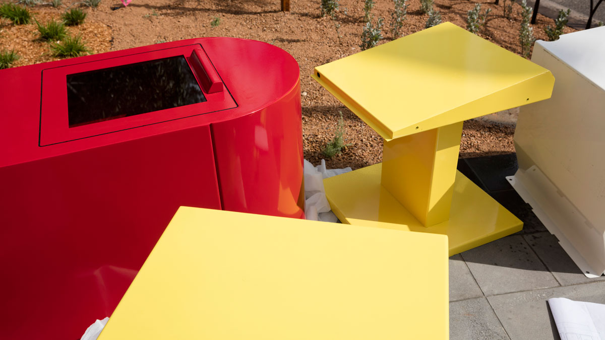 Red and yellow cabinets lying on the ground.