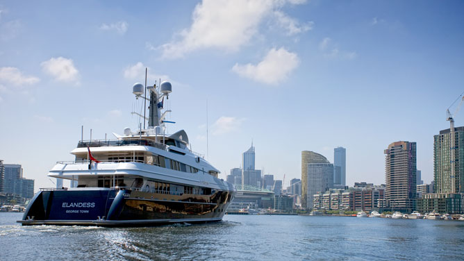 A superyacht sailing into Docklands